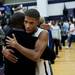 Pioneer senior Duane Simpson-Redmond embraces his father Duane after defeating Huron 64-47 on Friday, Jan. 18. Daniel Brenner I AnnArbor.com